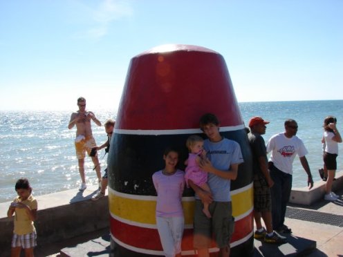 Southernmost Point in the U.S.. Also highest contrast of dudes in orange shorts.